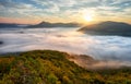 Autumn sunrise above mist and forest landscape, Slovakia, Nosice Royalty Free Stock Photo