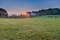 An autumn sunrise in Maastricht overlooking the meadows of the Sint Pieter hill with an historical farm Hoeve Zonneberg Royalty Free Stock Photo
