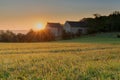 An autumn sunrise in Maastricht overlooking the meadows of the Sint Pieter hill with an historical farm Hoeve Zonneberg Royalty Free Stock Photo