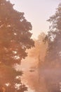 Autumn sunrise rural landscape. Fog on river. October fall calm morning misty scene Royalty Free Stock Photo