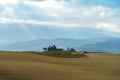 Autumn sunrise in Tuscany with wavy landscapes, fields, cypresses and clouds. Italy Royalty Free Stock Photo