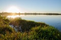 autumn sunset over a calm lake. Backlight sunlight. A great place to relax in nature with the whole family