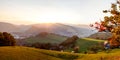 Autumn sunset panorama in the austrian alps shining at an alpine meadow at the mountains in styria Royalty Free Stock Photo