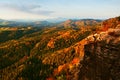 Autumn sunset in rocks. View over sandstone rocks to fall colorful valley of Bohemian Switzerland. Royalty Free Stock Photo