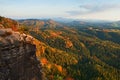 Autumn sunset in rocks. View over sandstone rocks to fall colorful valley of Bohemian Switzerland. Royalty Free Stock Photo