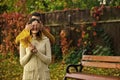 Autumn surprises. Man and woman with yellow tree leaves. Royalty Free Stock Photo