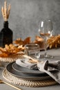 Autumn table setting with dry yellow oak leaves, fall decoration on grey table. Flat lay, top view. Thankisgiving day Royalty Free Stock Photo