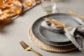 Autumn table setting with dry yellow oak leaves, fall decoration on grey. Thankisgiving day Royalty Free Stock Photo