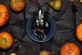 Autumn table setting with empty white plate and pumpkins. Royalty Free Stock Photo