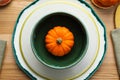 Autumn table setting with pumpkin on wooden background, flat lay Royalty Free Stock Photo