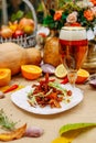Autumn table setting with pumpkins. Thanksgiving dinner.beer dumplings with sea salt and cheese spread Royalty Free Stock Photo