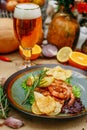 Autumn table setting with pumpkins. Thanksgiving dinner. beer shrimp with homemade potato chips