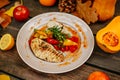 Autumn table setting with pumpkins. Thanksgiving dinner.grilled chicken breast with vegetables Royalty Free Stock Photo