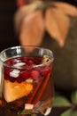 Autumn tea with lemon, spices in glass cup macro