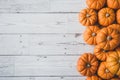 Autumn thanksgiving background. Leaves, pumpkins on wooden background.