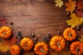 Autumn Thanksgiving background. Pumpkins, acorns and leaves on rustic wooden table top view Royalty Free Stock Photo