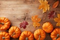 Autumn Thanksgiving background. Pumpkins and leaves on wooden rustic table top view Royalty Free Stock Photo