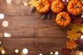 Autumn Thanksgiving background. Pumpkins and leaves on wooden table top view