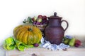 Autumn thanksgiving background, seasonal autumn berries, pumpkins, apples and flowers on a wooden table.Background of the Royalty Free Stock Photo