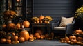 Porch of the backyard decorated with pumpkins and autumn flowers.