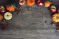 Autumn Thanksgiving Harvest Background with Apples, Pumpkins, Pears, Leaves, Acorn Squash and Nut Border Over Wood, Shot Directly Royalty Free Stock Photo