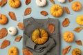 Autumn Thanksgiving holiday pattern on blue background from sweater with pumpkins and leaves top view. Harvest, fall and halloween Royalty Free Stock Photo