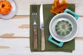 Autumn Thanksgiving table setting for dinner with plate, knife, fork decorated pumpkins. Top view Royalty Free Stock Photo