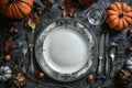 Autumn-Themed Table Setting with Pumpkins and Fall Leaves Royalty Free Stock Photo