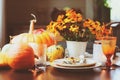 autumn traditional table setting for Thanksgiving or Halloween