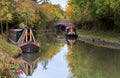 Autumn trees, Boats, bridges and Tunnels reflected in the Grand Union Canal Royalty Free Stock Photo