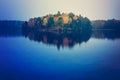 Autumn trees reflecting on lake