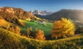 Autumn trees, village with houses, church, green meadows, rocks Royalty Free Stock Photo