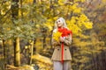 Autumn trend. Beautiful woman fashion model having fun in fall park outdoors. Royalty Free Stock Photo