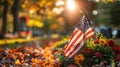 Autumn Tribute: National & Army Flags on Gravestone at Military Cemetery Royalty Free Stock Photo