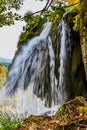 Autumn trip to Croatia, the park Plitvice Lakes. Picturesque splashing waterfall over the lake. The concept of ecological, active