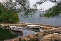 Autumn. Two fishing boats on the water in a small harbor on a cloudy day. Montenegro, view of Kotor Bay near Prcanj Royalty Free Stock Photo