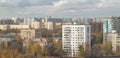 Autumn urban landscape - houses on the outskirts of Moscow at sunset, sky with clouds and residential buildings Royalty Free Stock Photo