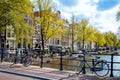 Autumn view of Amsterdam with parked bicycles, houses and a bridge. Amsterdam, Holland, Netherlands, Europe Royalty Free Stock Photo