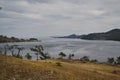 Autumn view of bay of Lake Baikal with islands and peninsulas and mountains on horizon. Ripples on water,