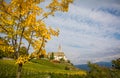 Autumn view of the Church of the idyllic village of Cortaccia. Cortaccia extends on the sunny side of the wine road. South Tyrol,