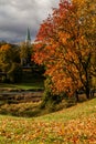 Autumn view of river wenta and yellow leaves on trees. Visible church in the backgorund Royalty Free Stock Photo