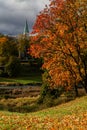 Autumn view of river wenta and yellow leaves on trees. Visible church in the backgorund Royalty Free Stock Photo
