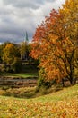 Autumn view of river wenta and yellow leaves on trees. Visible church in the backgorund Royalty Free Stock Photo