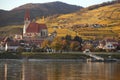 Autumn view of small austrian village on a river bank Royalty Free Stock Photo