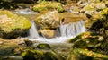 Autumn View of a Small Cascading Waterfall