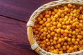 Autumn vitamin healthy food, sea buckthorn on wooden background, top view