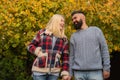 Autumn walk. Couple wear autumn clothes nature background. Man bearded hipster and girl wear plaid jacket. Checkered