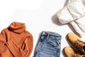 Autumn warm clothing, comfort red shoes, yellow sweater or turtleneck, blue jeans isolated on white. Female fashion Royalty Free Stock Photo