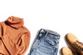 Autumn warm clothing, comfort red shoes, yellow sweater or turtleneck, blue jeans isolated on white. Female fashion Royalty Free Stock Photo