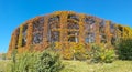 Autumn warm colors. Camouflaged hunting cabin surrounded by trees and hedges Royalty Free Stock Photo